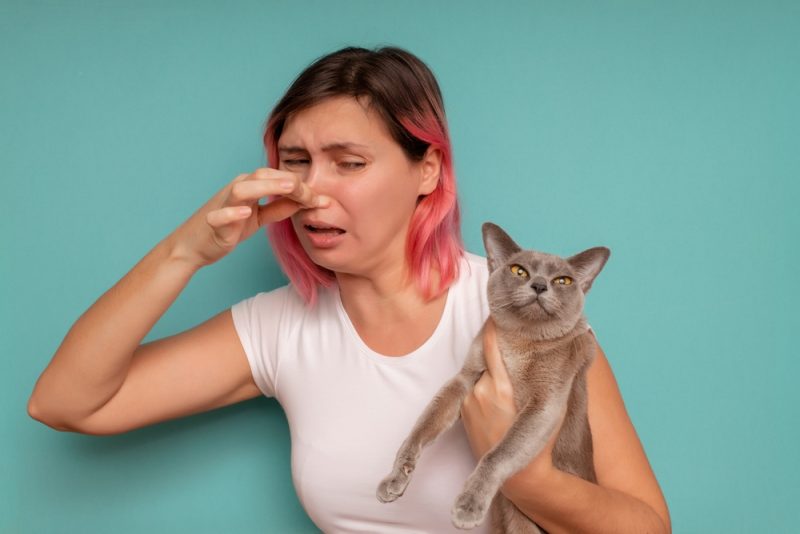 woman-holding-her-nose-because-of-a-bad-smell